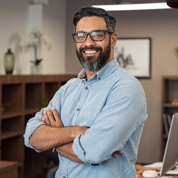 man with glasses smiling